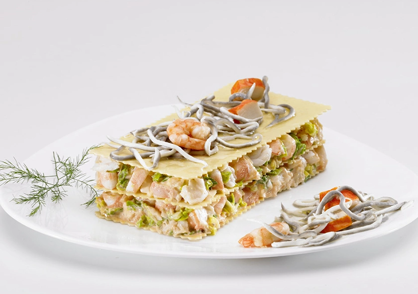 Lasaña de Merluza, Langostinos y Surimi