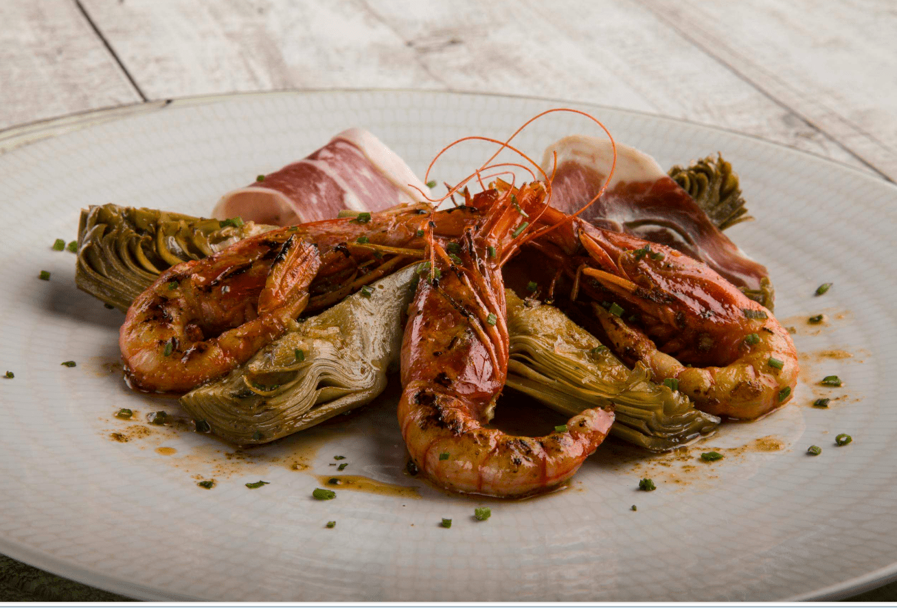 Alcachofas confitadas con gamba roja